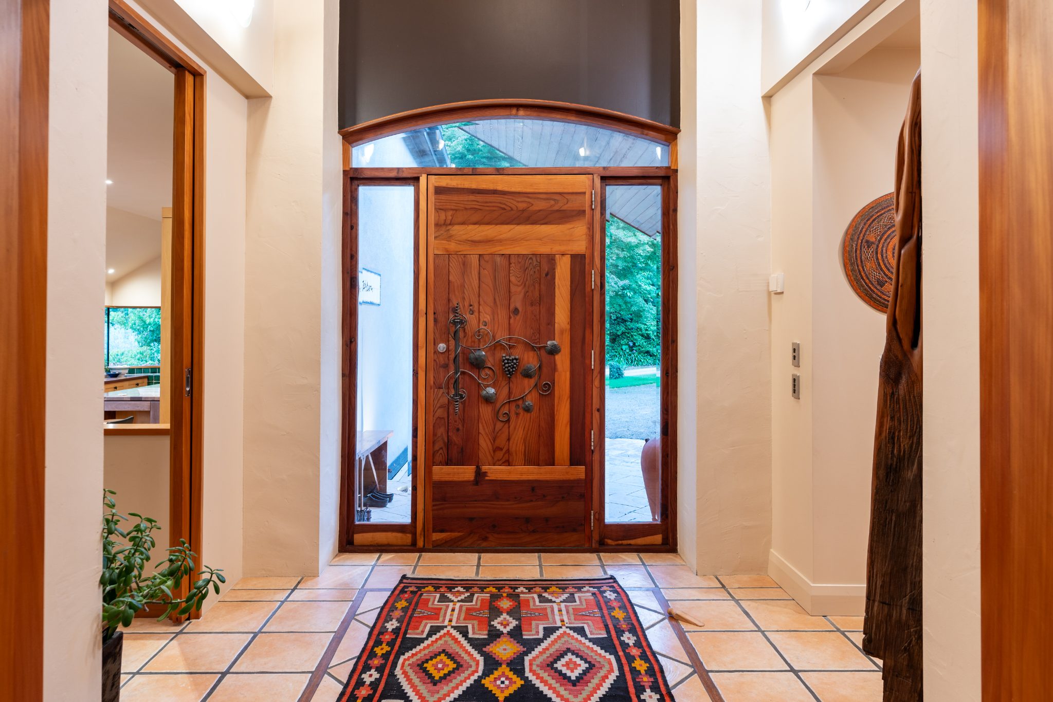 Grand foyer with timber door and decorative tilework