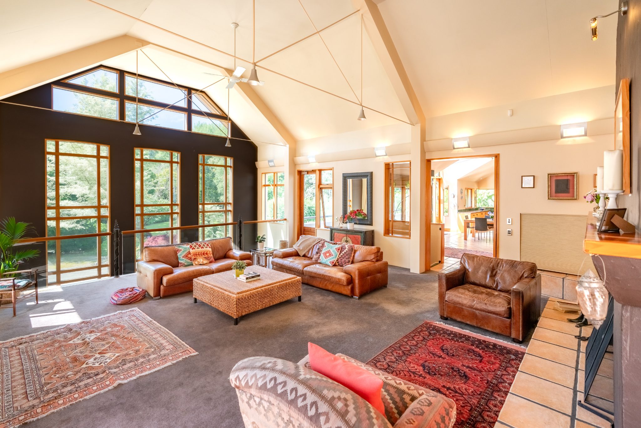 Grand lounge with raised fireplace and timber floors