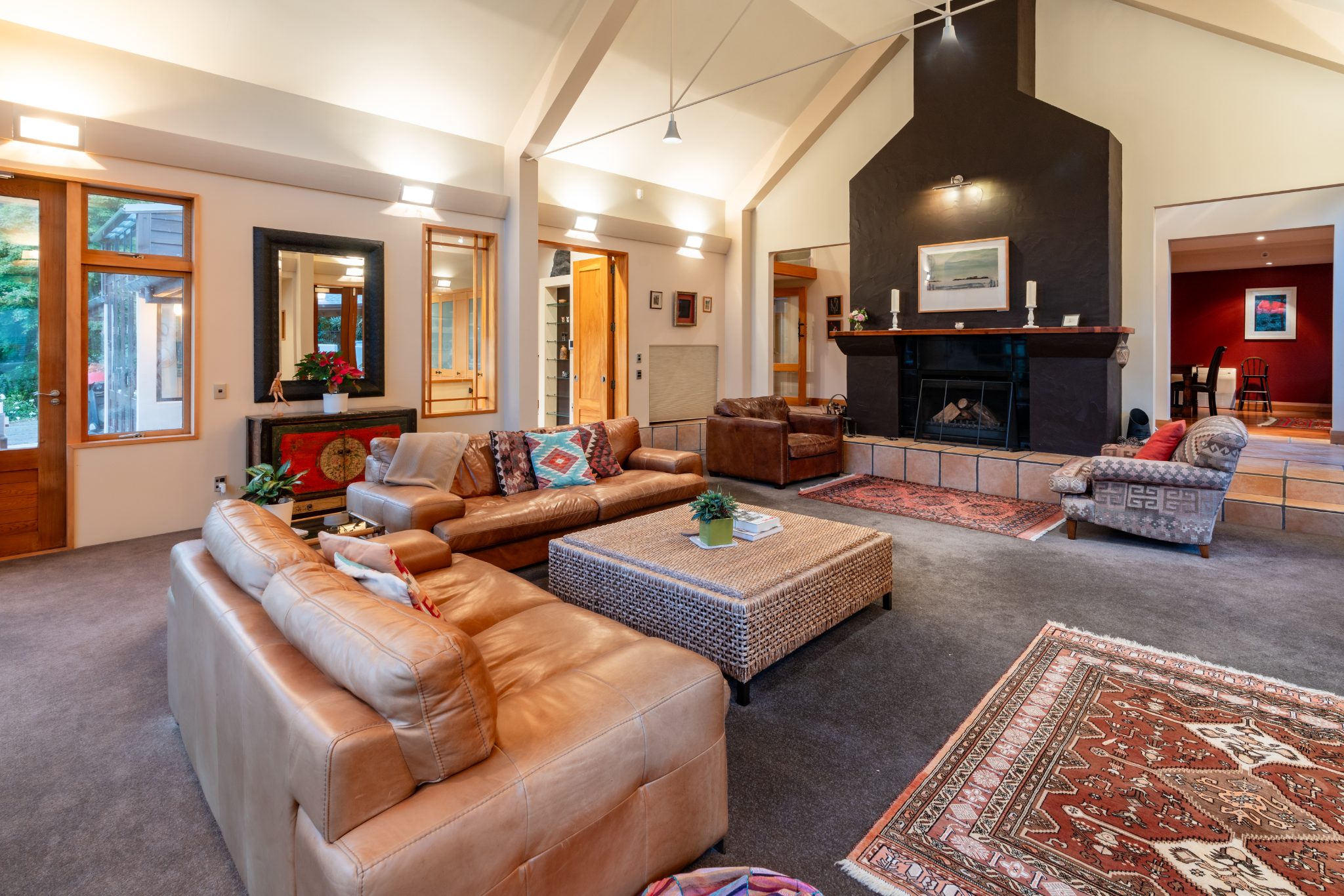 Living area with warm timber and built-in shelving